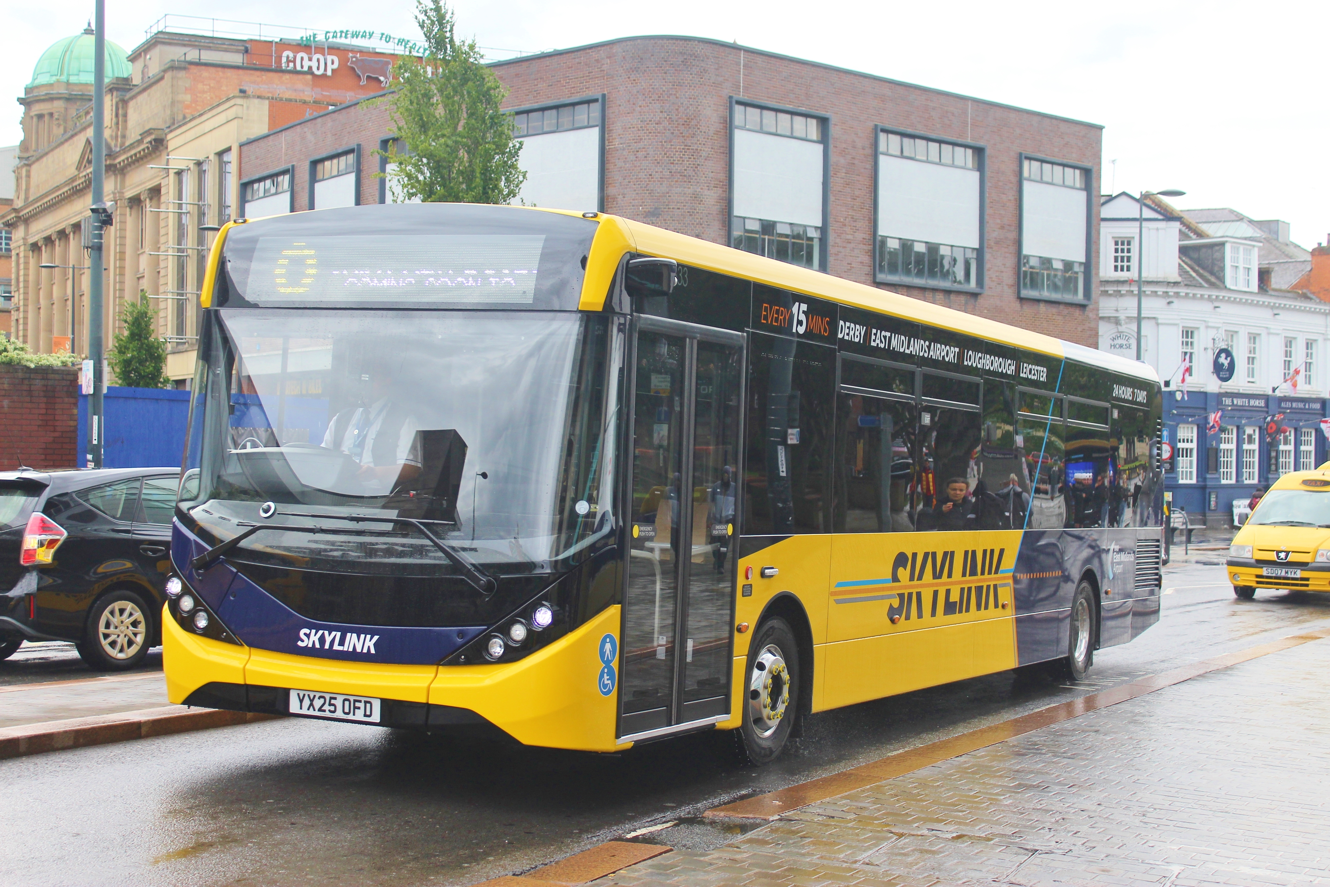 Brand new E200MMC 333 YX25 OFD is heading towards Derby Bus Station along the Morledge in Derby in a rain storm.